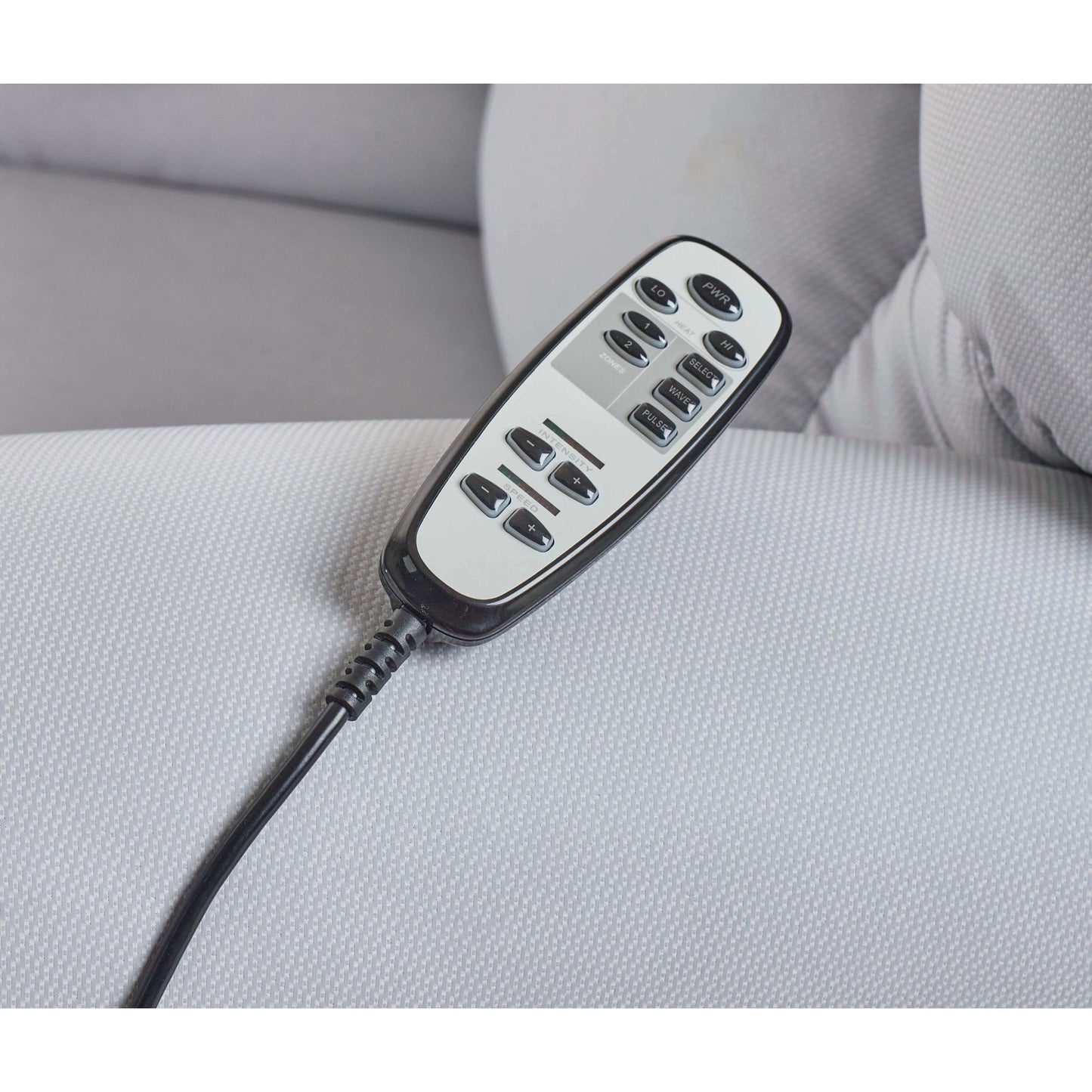 Sleep Chair remote controlling the upper and lower body. Remote features heat and massage controls